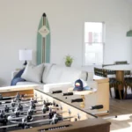 foosball table and beach decor in hotel suite entertainment area